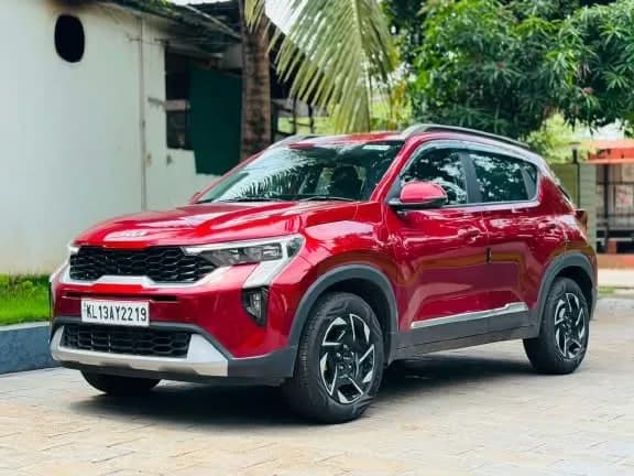 2024 Kia Sonet HTK+ iMT in red — photo 3 of 6