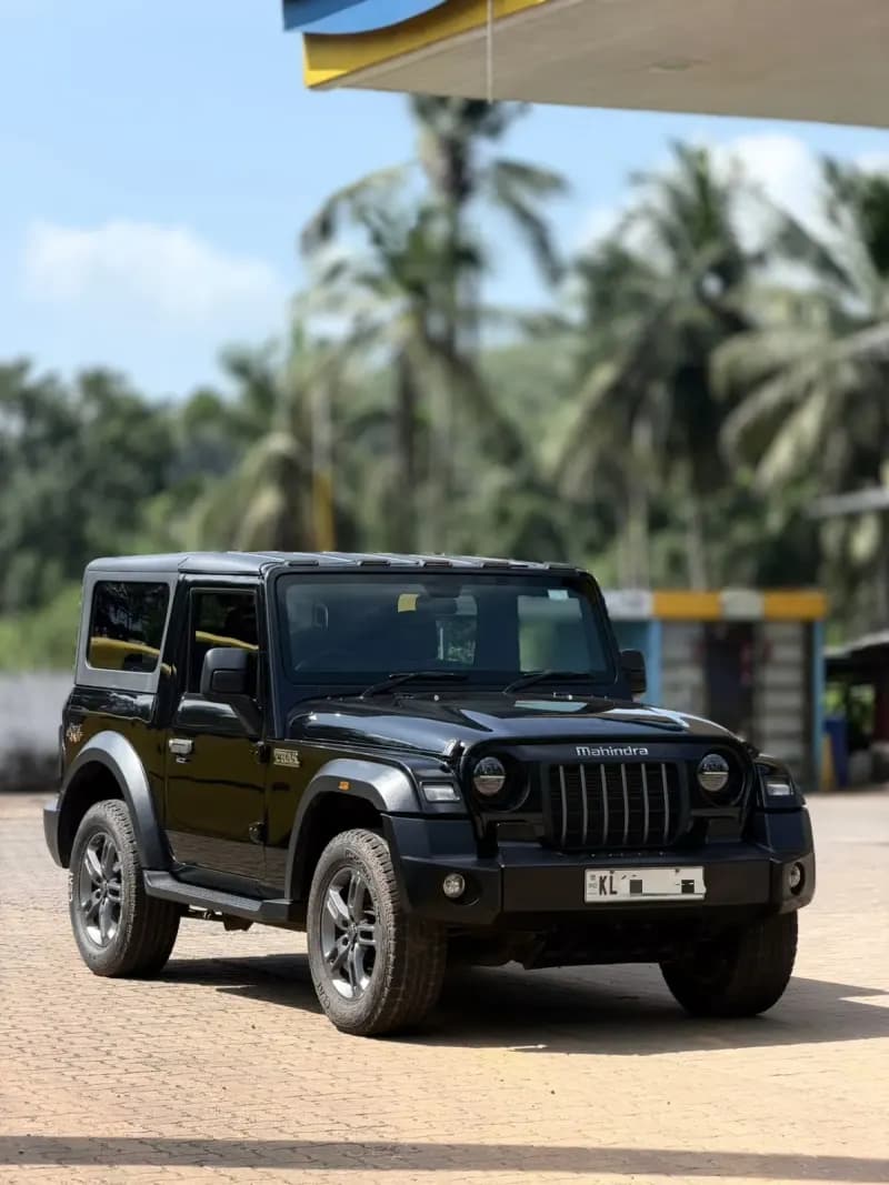 Used 2021 Mahindra Thar 4x4 diesel in black, front three-quarter view, for sale at RR Motors, Iritty, Kannur
