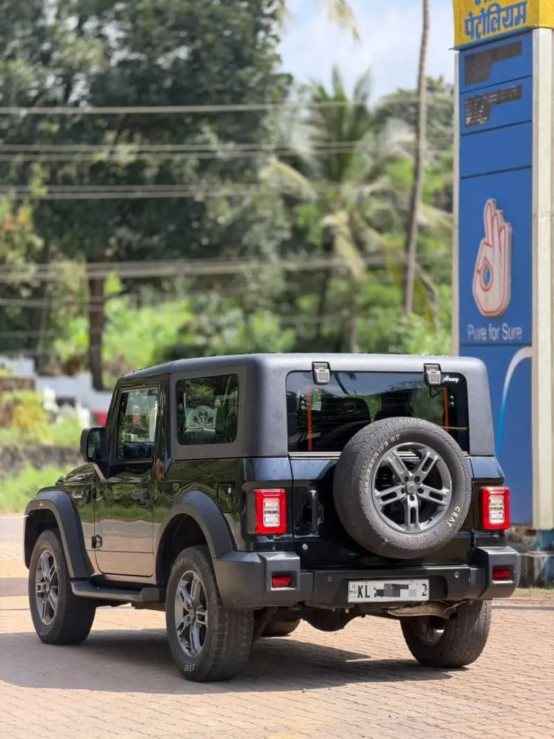 2021 Mahindra Thar 4x4 diesel in black, rear three-quarter view with spare wheel – RR Motors, Iritty, Kannur