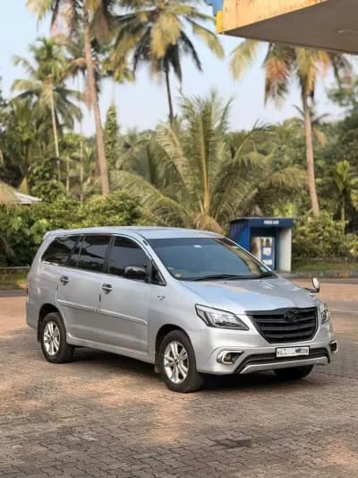 2013 Toyota Innova G4 diesel in silver, side view – RR Motors, Iritty, Kannur