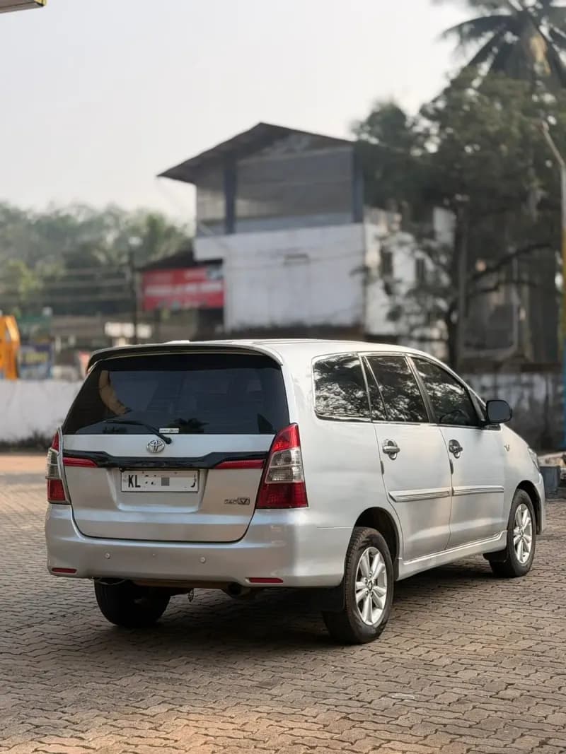 2013 Toyota Innova G4 diesel in silver, rear three-quarter view – RR Motors, Iritty, Kannur