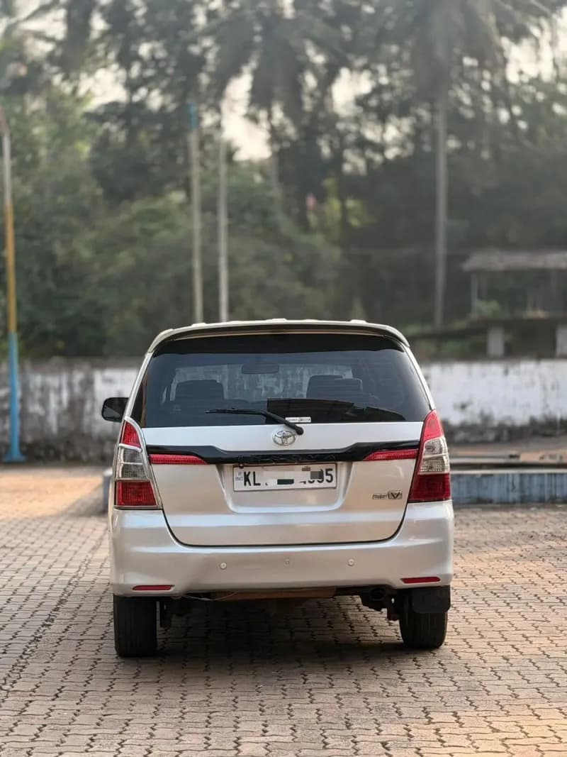 2013 Toyota Innova G4 diesel in silver, rear view – RR Motors, Iritty, Kannur