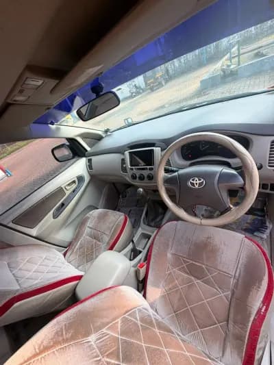 2013 Toyota Innova G4 diesel in silver, dashboard and front seats – RR Motors, Iritty, Kannur