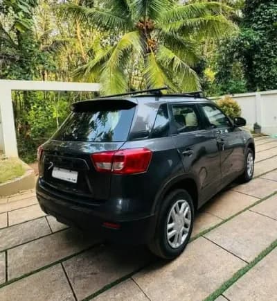 2018 Maruti Suzuki Vitara Brezza VDi diesel in grey, rear three-quarter view – Car City, Mattanur, Kannur