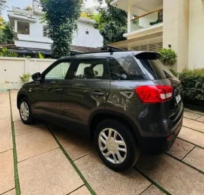 2018 Maruti Suzuki Vitara Brezza VDi diesel in grey, rear three-quarter view from the left – Car City, Mattanur, Kannur