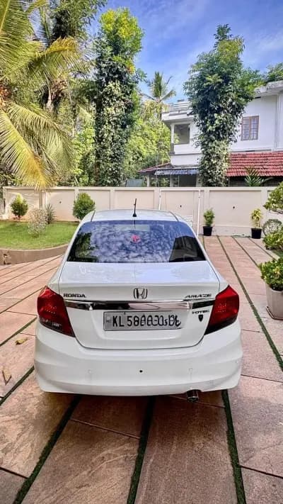 2015 Honda Amaze 1.5 E diesel in white, rear view – Car City, Mattanur, Kannur