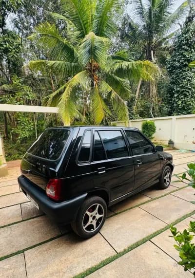 2013 Maruti Suzuki 800 AC petrol in black, rear three-quarter view from the right – Car City, Mattanur, Kannur
