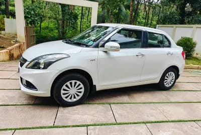 2016 Maruti Suzuki Swift Dzire VXi petrol in white, front three-quarter view from the left – Car City, Mattanur, Kannur