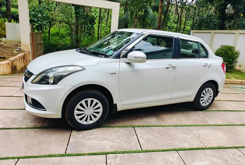2016 Maruti Suzuki Swift Dzire VXi petrol in white, front three-quarter view from the left – Car City, Mattanur, Kannur