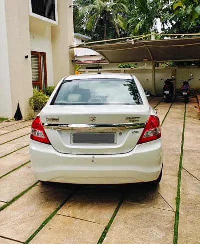 2016 Maruti Suzuki Swift Dzire VXi petrol in white, rear view with VXi badge – Car City, Mattanur, Kannur