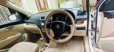 2016 Maruti Suzuki Swift Dzire VXi petrol in white, dashboard and manual gear lever – Car City, Mattanur, Kannur