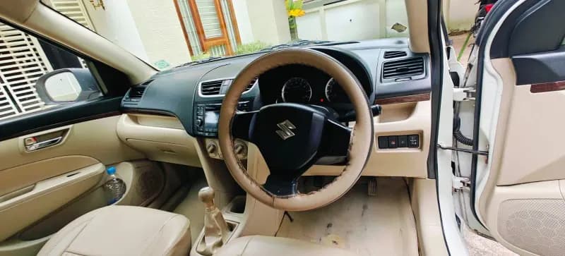 2016 Maruti Suzuki Swift Dzire VXi petrol in white, dashboard and manual gear lever – Car City, Mattanur, Kannur