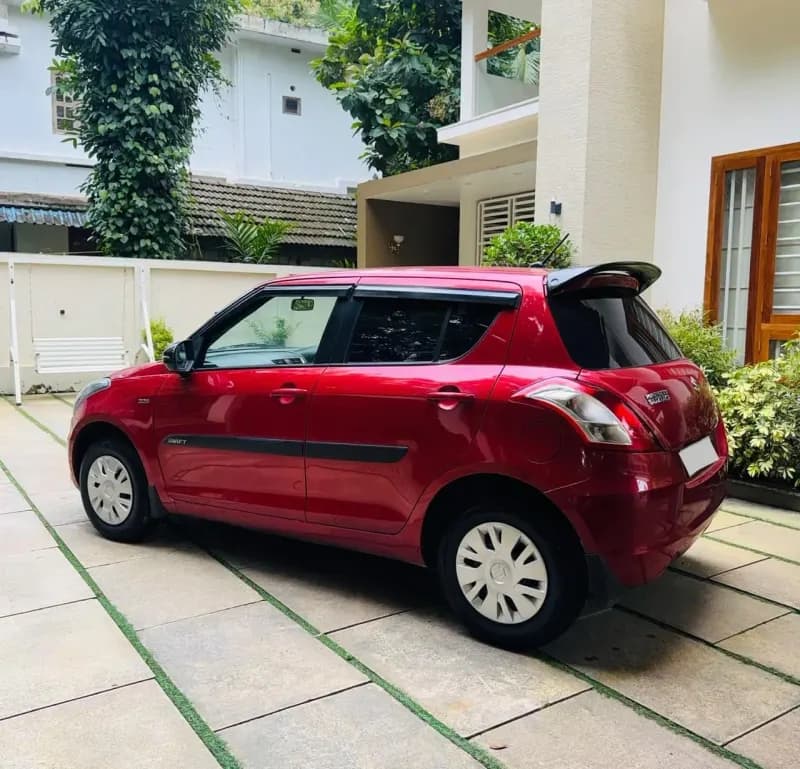 2012 Maruti Suzuki Swift VDi diesel in red, side view – Car City, Mattanur, Kannur
