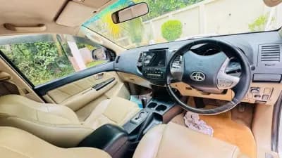 2014 Toyota Fortuner 4x2 automatic diesel in white, dashboard and automatic gear selector – Car City, Mattanur, Kannur