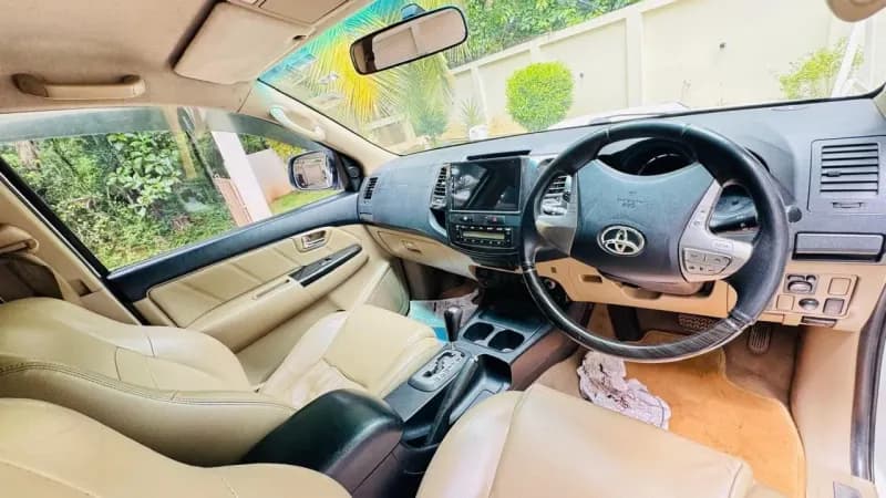 2014 Toyota Fortuner 4x2 automatic diesel in white, dashboard and automatic gear selector – Car City, Mattanur, Kannur