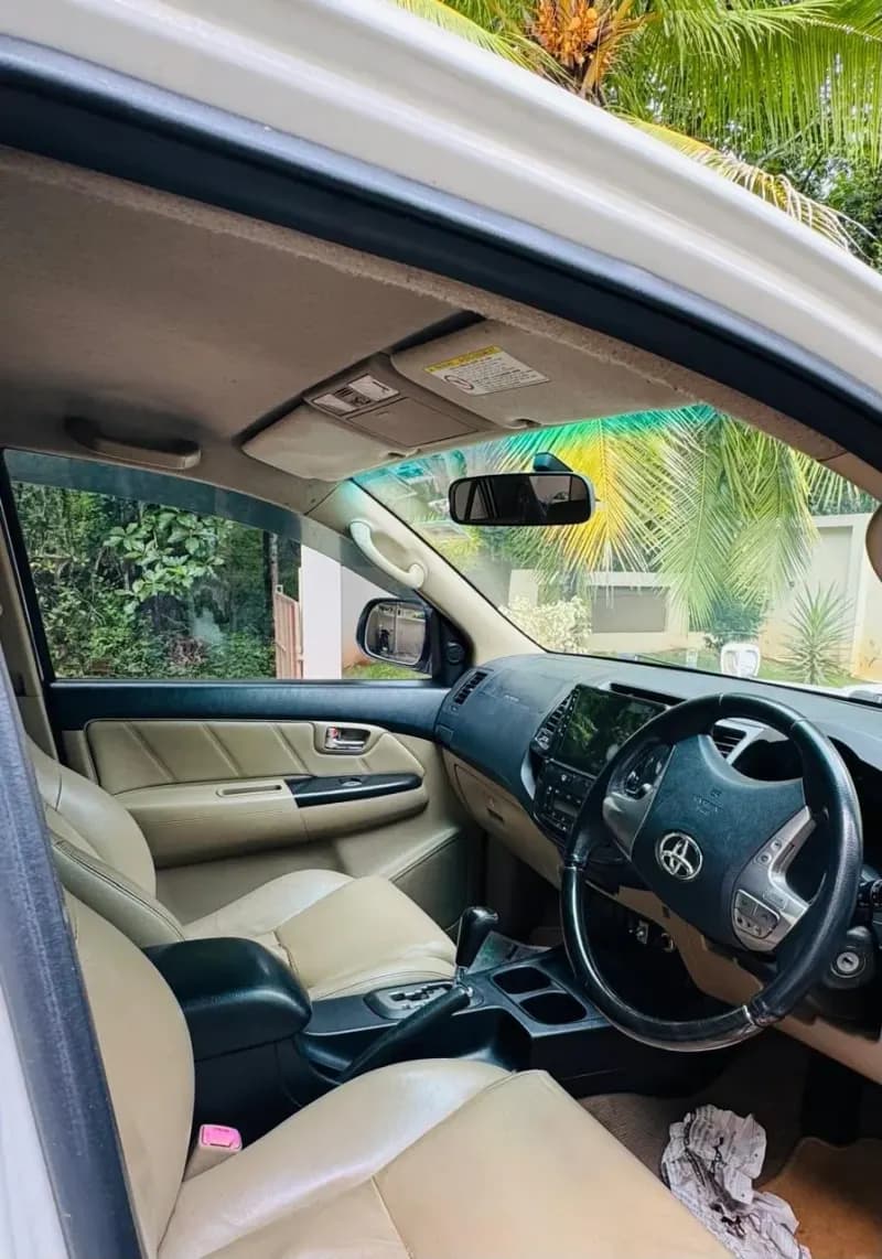 2014 Toyota Fortuner 4x2 automatic diesel in white, front seats – Car City, Mattanur, Kannur