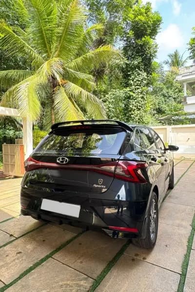 2022 Hyundai i20 Sportz diesel in blue, rear three-quarter view – Car City, Mattanur, Kannur
