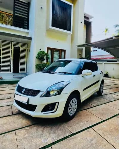 2017 Maruti Suzuki Swift VDi diesel in white, front three-quarter view from the left – Car City, Mattanur, Kannur