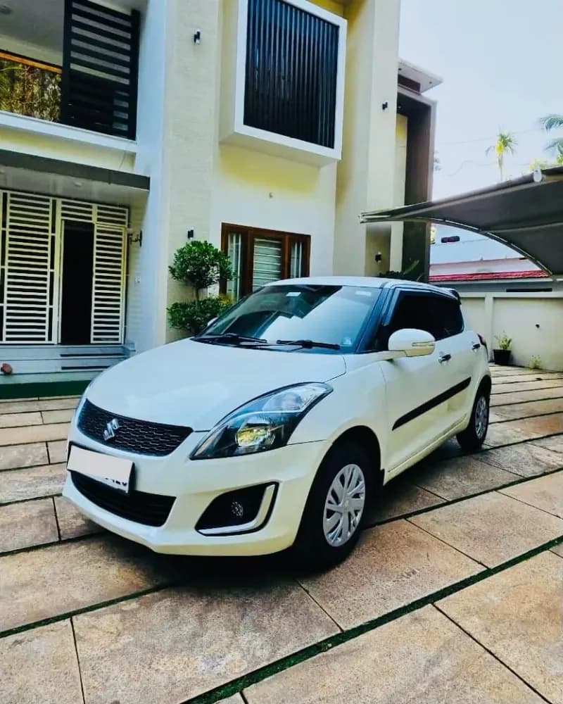 2017 Maruti Suzuki Swift VDi diesel in white, front three-quarter view from the left – Car City, Mattanur, Kannur