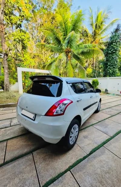 2017 Maruti Suzuki Swift VDi diesel in white, rear three-quarter view – Car City, Mattanur, Kannur